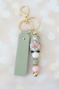 Gnome Tulip Wrist Strap Keychain – Pastel Cream Bokeh