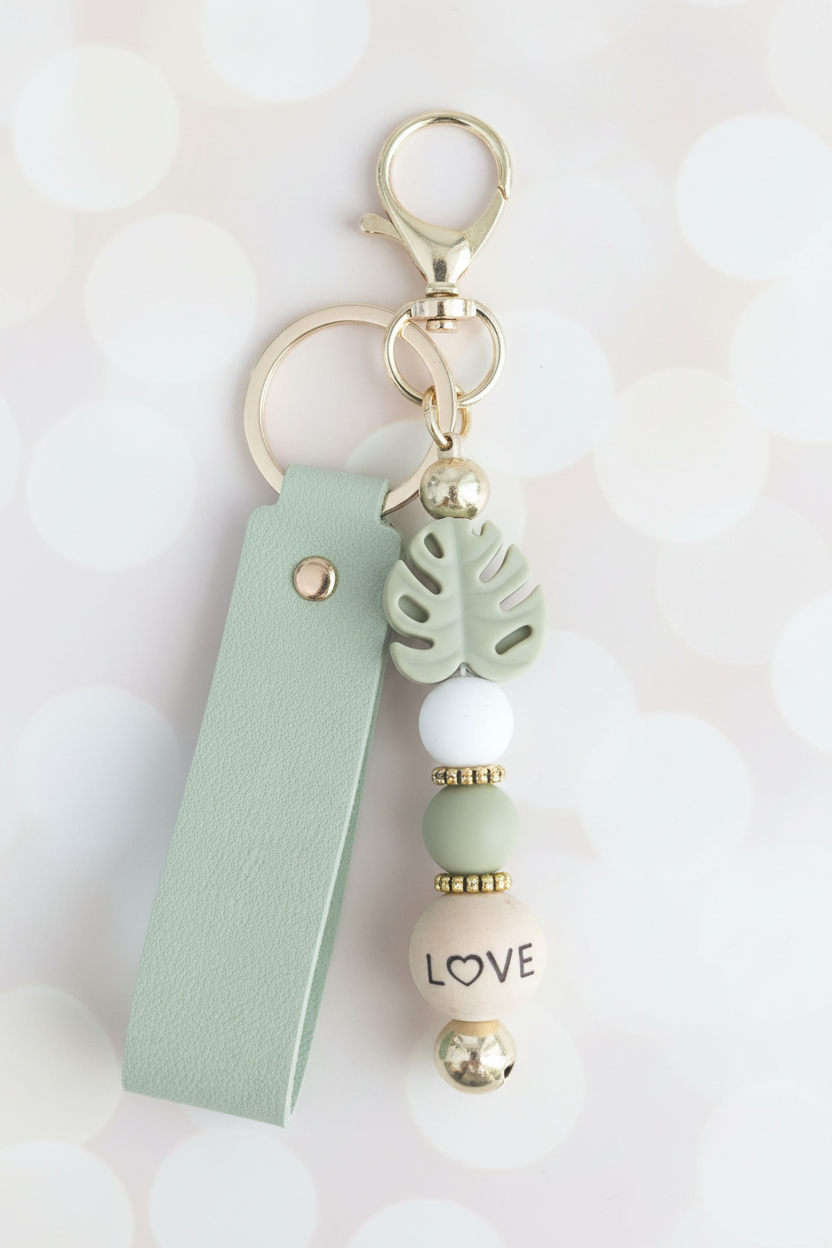 Monstera LOVE Sage Keychain – Pastel Cream Bokeh