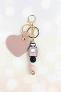 Perfume Bottle Keychain – Pastel Cream Bokeh