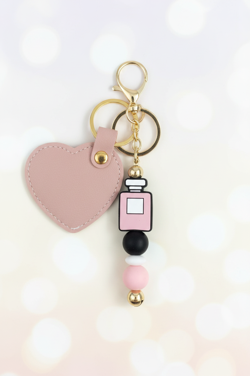 Perfume Bottle Keychain – Pastel Cream Bokeh