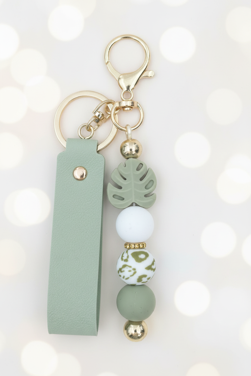 Sage Green Monstera Keychain – Pastel Cream Bokeh