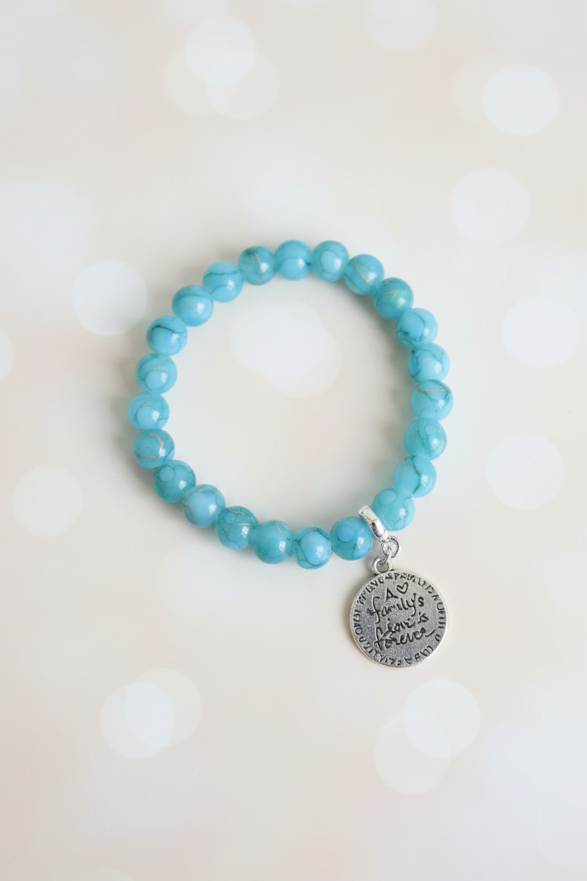 Turquoise Medallion Bracelet – Pastel Cream Bokeh