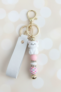 White Cat Keychain – Pastel Cream Bokeh